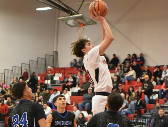 The GHS Pirates were victorious in their home tournament, the Eddie Pena Holiday Classic, this past weekend as they swept 3 teams and are currently 9-3. In this photo John 'JJ' Horacek,13, towers over defenders from Socorro High School (2-5). Franklin Romero - CC