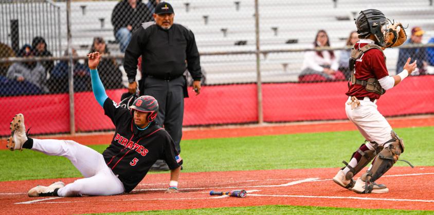 Dominick Gonzales, 5, slides into home plate for a score against the Belen Eagles in a recent home game. Franklin Romero - CC