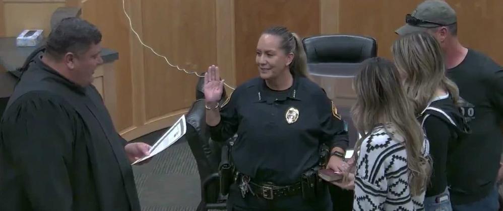 The newly sworn-in Chief of Police Maxine Monte is seen, with her hand on a family bible and surrounded by her family, reciting the oath of her new office. Municipal Judge Michael Cavin administered the oath. Chief Monte made history as the first woman to ever lead Grants Police Department as chief, and laid out a plan to bring crime under control in the city. Courtesy Photo
