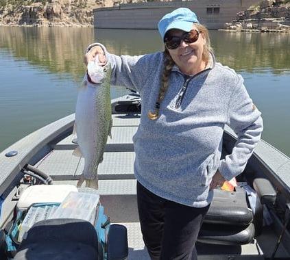 Irene Owensby caught four trout using a red Rooster Tail on April 10. “I hooked a 22-inch rainbow and three smaller ones,” she said. “I watched the eagles catch fish, also. Take your kids fishing – great lake.” Courtesy Photo