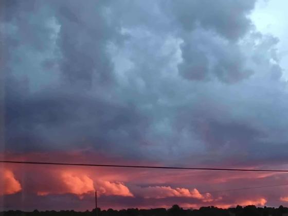 Evening storm clouds glow over the Zuni Mountains near Bluewater, New Mexico, on September 12, 2025. Scattered showers like this one brought brief relief to parts of Cibola County, underscoring the real-world impact behind ongoing water monitoring and drought reports. Photo by Kristine Simonson
