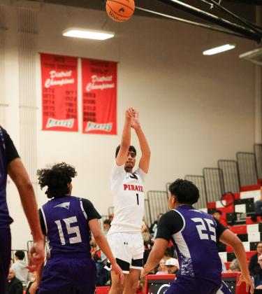 Elijah Marquez,1, puts up a shot against Miyamura High School at a recent home game. The Pirates are currently 2-1 after defeating Laguna-Acoma (0-4) in their most recent game. Courtesy of Ron Gonzales