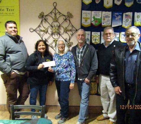 Roger and Evelyn Siegmann presented a check to the Grants-Milan Rotary Club for over $1,000. The check goes to support the Backpack Program which feeds underprivileged students in Cibola County. Courtesy Photo