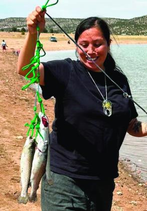 Heather Atsye of Laguna (above left) caught three rainbow trout using Rainbow Glitter PowerBait on April 12. Courtesy Photo