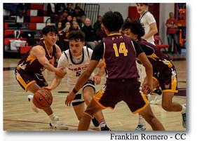 Tristin Fernandez,5, of the GHS boys basketball team splits the defense as he makes his way to the hole for a bucket. The Pirates are 4-2 heading into tournament season this week.