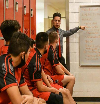 In this file photo Grants High School boys head coach Landon Chavez talks to players at halftime in a locker room earlier this year. "This season was unprecedented... we experienced it tall," said Chavez as he looked back at the 2021-2022 season. Franklin Romero - CC