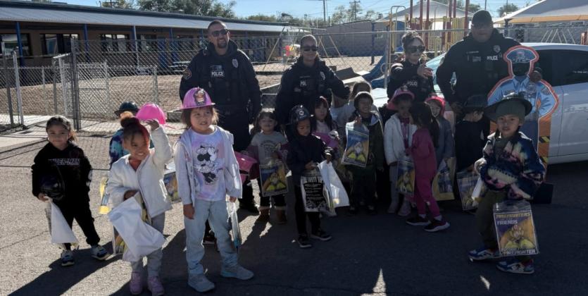Police Officers Join Local Students for Halloween Fun