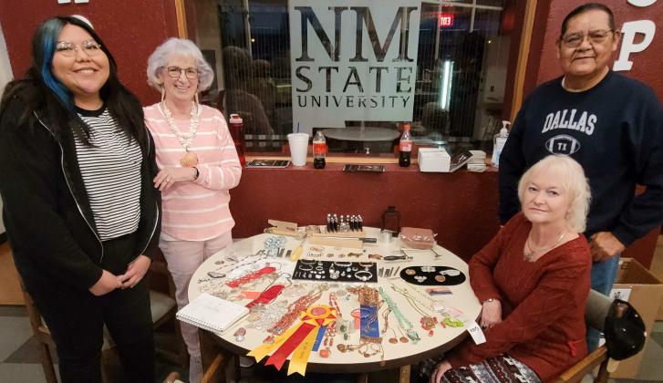 Destiny Estevan, Claudette Jaramillo, Renee Post, and Buick with the silversmithing art they created throughout the semester at NMSU. Nathan Chavez - CC