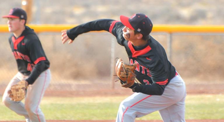 Markos Garcia, a senior, pitches away as teammate and third baseman Caleb McDaugale looks on intensely at recent home game. The Pirates, who received a four seed in the state baseball tournament, will host the 13 seeded Bloomfield Bobcats (14-11, 5-5) over the weekend. Franklin Romero - CC