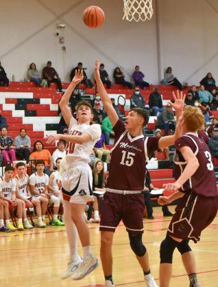 Sophomore John 'JJ' Horacek,20, of the Grants High School boys’basketball team takes it to the hole at the Eddie Pena Holiday Classic held this week at the Port of the Pirates. The Pirates lost the first game of the tournament, on Monday December 20, against the undefeated Magdalena Steers (9-0). Franklin Romero - CC