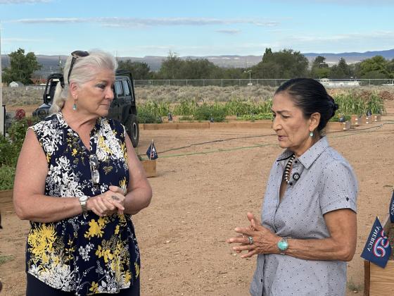 Grants Community Pantry Executive Director Alice Perez speaks with Deb Haaland during a tour of the pantry’s Community Garden Friday, Aug. 21. Perez discussed food insecurity in the region and told Haaland that people from across the economic spectrum can find themselves needing assistance when circumstances suddenly change.