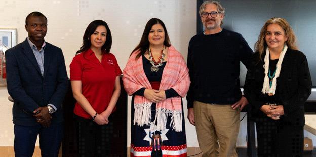 Dr. Cristina Carpenter (center), the enthusiastic Interim Director of the RN Program, welcomes new faculty and team members in the vibrant hospitality room! PHOTO: Courtesy