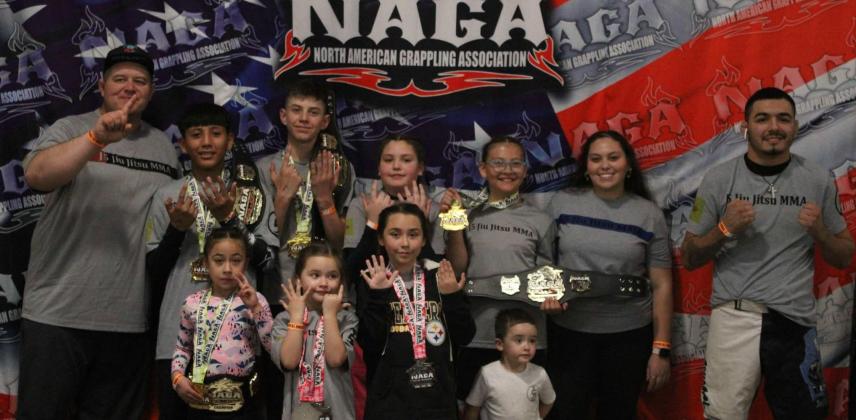 Joey Lujan, instructor at J5's Jiu Jitjsu and MMA fitness center poses with his team at a recent N.A.G.A tournament they participated in. Courtesy Photo
