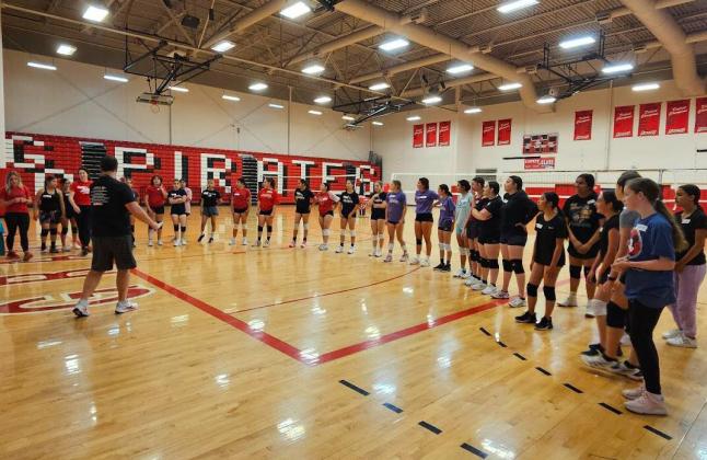 Attendants of the Volleyball camp listen to the coaches of the UNM volleyball team Arieanna Crowson - CC