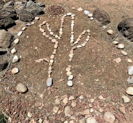 New rock art was made in the form of a cactus, with a sun hovering on the top left side, for Earth Day 2022 in the NMSU Grants Campus Garden. Kylie Garcia - CC