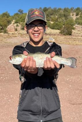 Kaylub Sanchez poses with one of two rainbow trout he caught using PowerBait on April 24 at Bluewater Lake. Courtesy Photo