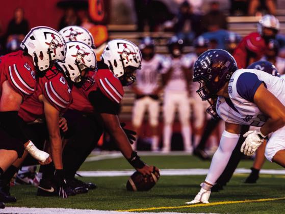 Grants High School and Manzano players line up at the line of scrimmage during their Sept. 18 matchup at GHS. Both teams prepare for the snap as the Pirates’ offense gets set. Jay Langford- Student Journalist