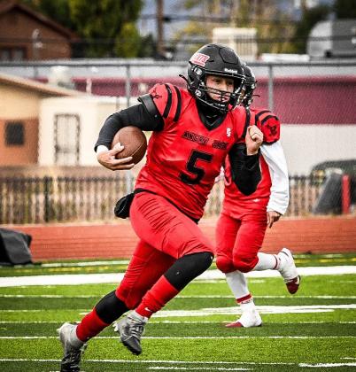 Tristin Fernandez on the quarterback keeper in an earlier football game this past season. Fernandez reflected on his 2024 season as the Pirates quarterback. Franklin Romero - CC