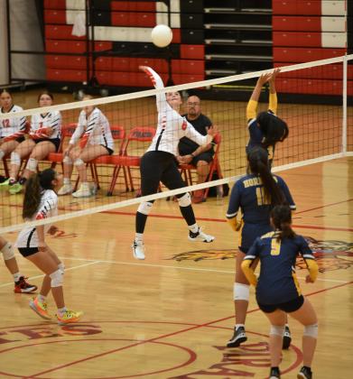 Lady Pirate Alexia Munson (8) with a big hit over the net at a recent district volleyball game. The lady Pirates are currently 8-10,1-3 as they are playing in the heart of district play. Next game is Thursday, October 26th against Valencia High School (10-8, 2-1). Franklin Romero - CC