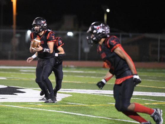 In this file photo, Tristin Fernadez, 5, readies himself for a handoff at a recent home game. The Pirates lost a close game to rival, the Bernalillo Spartans last Friday on the road. The score was 15-12. They Pirates are currently 5-2 and 4-2 with one more game left to play in district play. Franklin Romero - CC