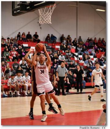 Dominick Gonzales, 34, showed off his post moves this past Monday night at a district tournament home game with the Belen Eagles. The Pirates and Belen went into double overtime and Belen came out with a 71-63 win.