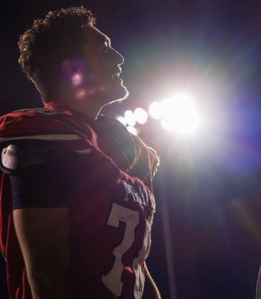 Junior Antonio DeVargus looks toward the field beneath the stadium lights during the Pirates’ game against Valencia on Aug. 28, 2026, at Grants High School. Jay Langford- Student Journalist