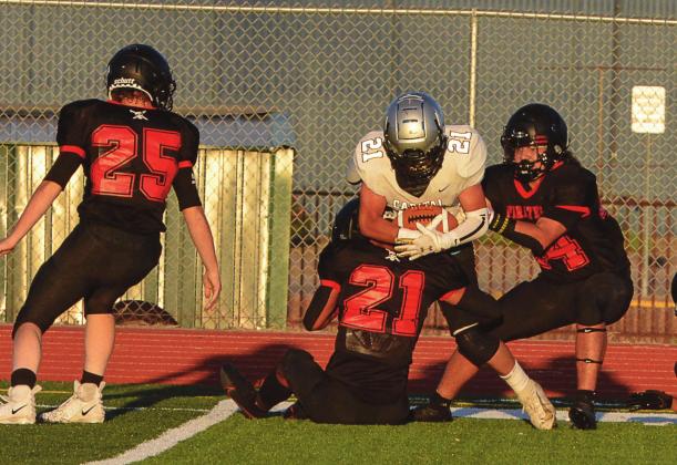 Seniors Tyler Everhart (21) and William Archuleta (44) in a defensive play this past Friday at the Port of the Pirates. The Pirates lost their season opener to 5-A Capital Jaguars 55-20 this past Friday at the Port of the Pirates. Franklin Romero - CC