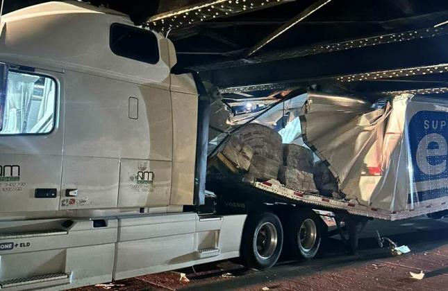 A semi-truck became wedged under the BNSF train bridge on Fifth Street in Grants, NM, on the evening of September 18, 2024, causing significant damage and blocking traffic. Denise Henson, who GPD Chief Maxine Monte said is not affiliated with any local organization, was arrested for the accident. Courtesy Photos