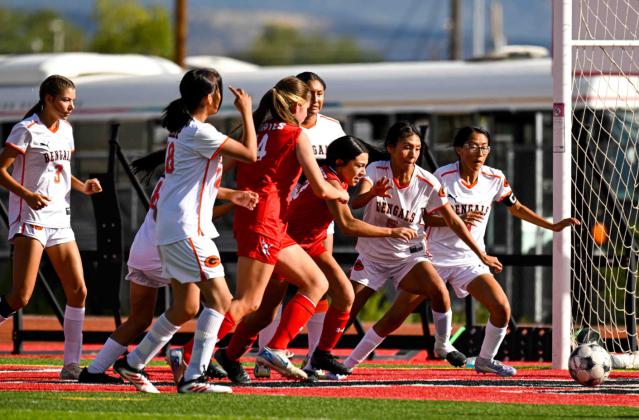 Lady Pirate Madisyn Chavez ,13, and teammate Marli Predergast,14, battle it out with the Gallup defense for a goal attempt this past Monday in a home game. The Lady Pirates are currently 1-7 heading to Bloomfield for their next game. Franklin Romero - CC