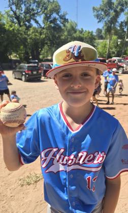 Fifth grader Owen Silva is all smiles as he prepares to go with the Duke City Hustlers to the Easton World Series in Orlando, Florida this weekend. Silva, an outfielder, for the Hustlers will have his hands full as the other three teams in his 10 and under division are top teams from big states, California,