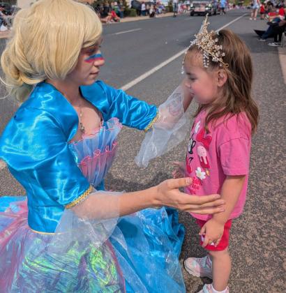 Zia Gonzales, 3, is crowned by Elsa during theAmerica 250 Fourth of July Parade on Route 66 near the intersection of Second Street. Sylvia Anzures Gonzales - CCs