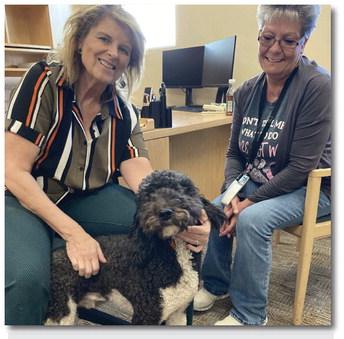 Cowboy the Emotional Support Dog with District Attorney Barbara Romo (left) and Nina Salazar (right). Faith - CC