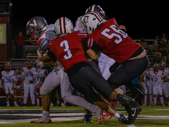 Grants defenders converge on a Valencia ball carrier, bringing him down during the Pirates’ game against Valencia on Aug. 28, 2026, at Grants High School. Jay Langford- Student Journalist