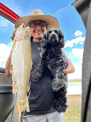 Erwin Sice and Ninja caught a golden-colored rainbow trout using worms on July 26. “We always have a great time whether we’re lucky or not,” Erwin said. Courtesy Photo