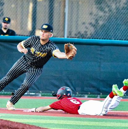 Estevan Barela, 6, slides into 3rd base this past weekend at the Nusenda State 4A baseball quarter final game in Albuquerque. Franklin Romero - CC