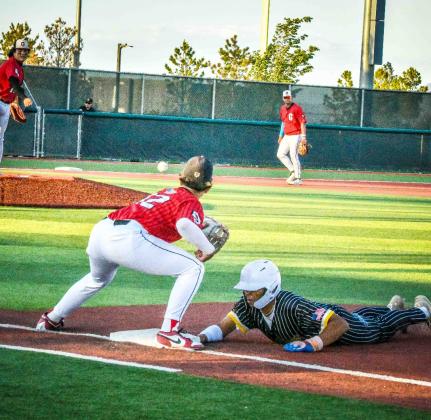 GHS pitcher Niko Young, 13, looking for an out on first base as he throws it to Ethan Taylor,12, at the quarter final game this past week. Franklin Romero - CC