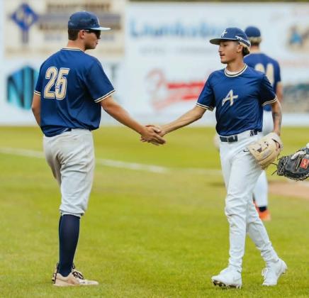 Recent Grants High School graduate Estevan Barela fist pumps a teammate of his summer baseball team, ABA, after the team went 5-1 in a qualifying tournament last weekend to make it into the Connie Mack World Series. Courtesy Photo