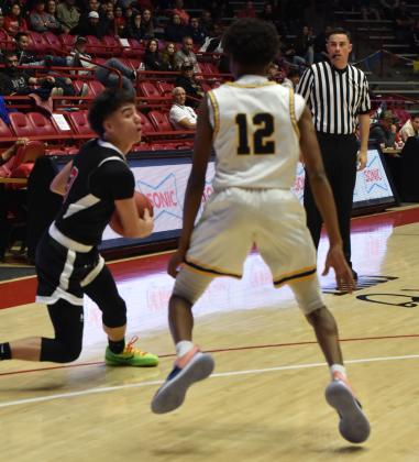 Boudy Melonas, 3, with a move on a defender last week in the quarter-final games against the Highland Hornets. Melonas had 27 points for the Pirates in that game. Franklin Romero - CC