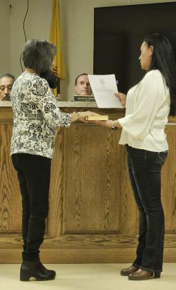 Arieanna Crowson - CC Municipal Judge Willie Jaramillo is sworn in by Village Clerk Denise Baca following his reelection.