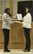 Arieanna Crowson - CC Board Trustee Roseanne Lopez is sworn in by Village Clerk Denise Baca following her reelection.