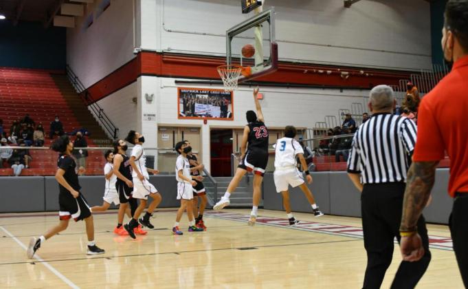 Count the bucket! GHS senior Isaiah Hernandez, 23, takes the ball to the hole against the Shiprock Chieftains last week in the Pirates’ last game of the year. The Pirates defeated the Chieftains by a score of 68-45 and will end 2021 with a 6-3 record as they have a break before facing the Taos Tigers on Monday, January 3 at the Port of the Pirates. Franklin Romero - CC