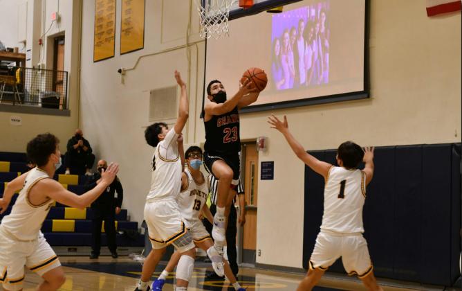 Grants Pirates senior Isaiah Hernandez, 23, with bucket last Friday in a district game between the Highland Hornets (14-3,3-0) and the Pirates. The Pirates lost that game by a score of 69-31 and are currently 8-9 and 1-1. Franklin Romero - CC