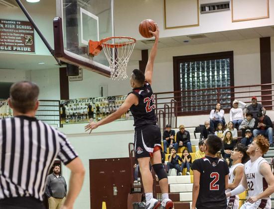 Dunk Time! Senior Isaiah Hernandez, 23, with a big dunk this past Tuesday against district rival the Belen Eagles. Despite Hernandez's dunk and a spirited fourth quarter effort the Pirates fell to the Eagles 61-43 in the first round of their district tournament and were eliminated. The Pirates finished the season 9-15, 2-6 and will lose nine seniors. Franklin Romero - CC