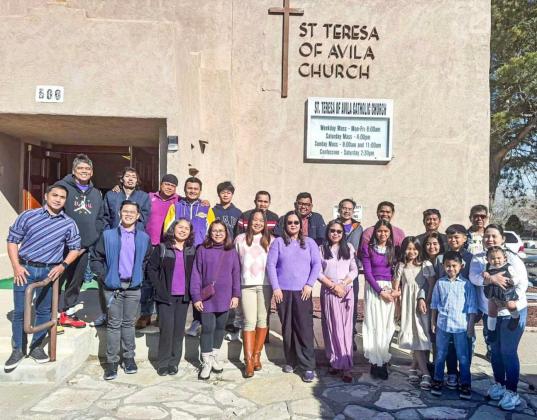 After Sunday service at Saint Teresa of Avila Church, the Grants Filipino choir gathers for a group smile. Courtesy Photo