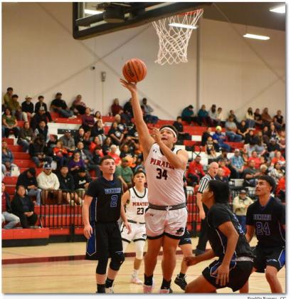 Franklin Romero - CC Dominick Gonzales (34) for the GHS Pirates boys’ basketball team with a bucket at a recent home game. The Pirates are 1-1 in district play after splitting their last two games. They are currently 13-7 and will play on the road against Highland High School (145,1-0) on Tuesday, January 30