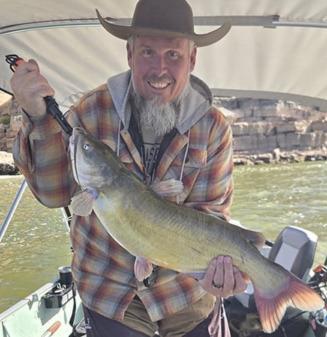 Bluewater Lake: Jeremy Pitts caught an 11-pound catfish using chicken livers near the dam around 1 p.m. on Nov. 1. “We got a few bites, but this was the keeper,” Jeremy said. Courtesy Photo