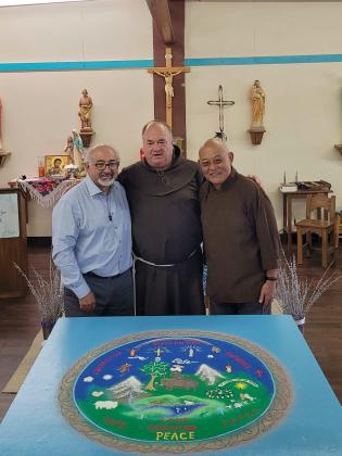 Losang Samten shares the art of sand painting with St Joseph Mission School. Pictured: Antonio Trujillo, Christopher Kerstiens, Losang Samten. Nathan Chavez - CC