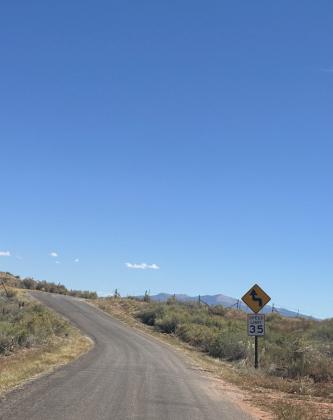 September 2024, Mount Taylor peaking past the horizon up cemetery road in Bluewater. Diego Lopez - CC