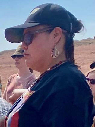 Teracita Keyanna listens to U.S. EPA and landfill officials discuss the plan to truck waste from her home community to the landfill.