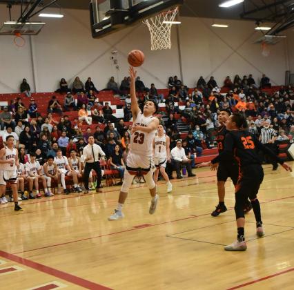 Isaiah Griego, 2, takes it inside for the Pirates last week in a home game against the Gallup Bengals (10-6), who defeated the Pirates 77-64. The Pirates are currently 79 and will start district play on Tuesday, January, 17 against the Valencia Jaguars (7-11). The Lady Pirates (8-9) will also begin district play on Tuesday, against the Lady Jaguars of Valencia (12-5) on the road. Franklin Romero - CC